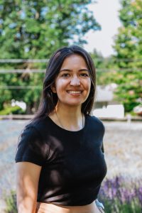 A person in nature wearing a black shirt